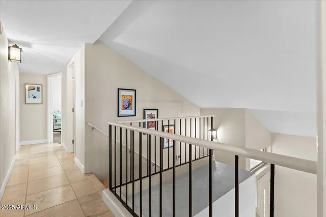 a view of a hallway with windows