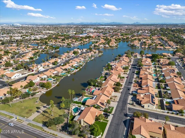 an aerial view of residential houses with outdoor space
