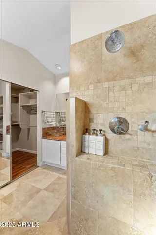 a bathroom with a tub a sink and a shower