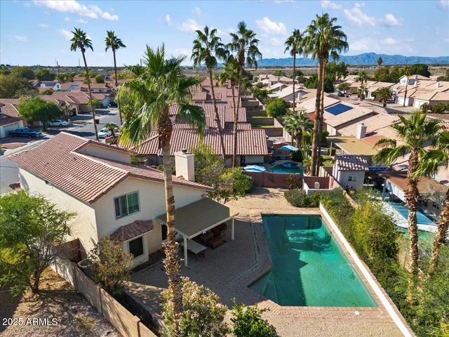 an aerial view of residential houses with outdoor space