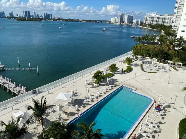 an aerial view of a house with a table chairs and a swimming pool