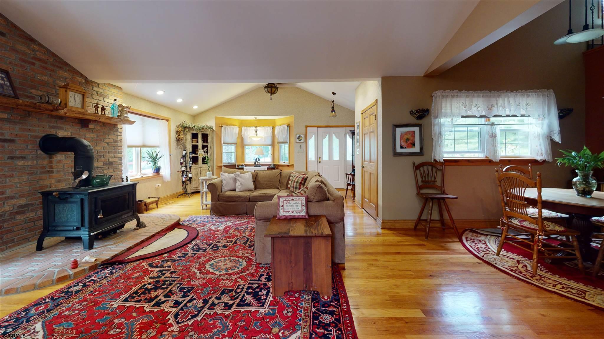 105 Tyler Road Ocean View, NJ 08230 - Photo 14 of 43 a living room with furniture and a flat screen tv