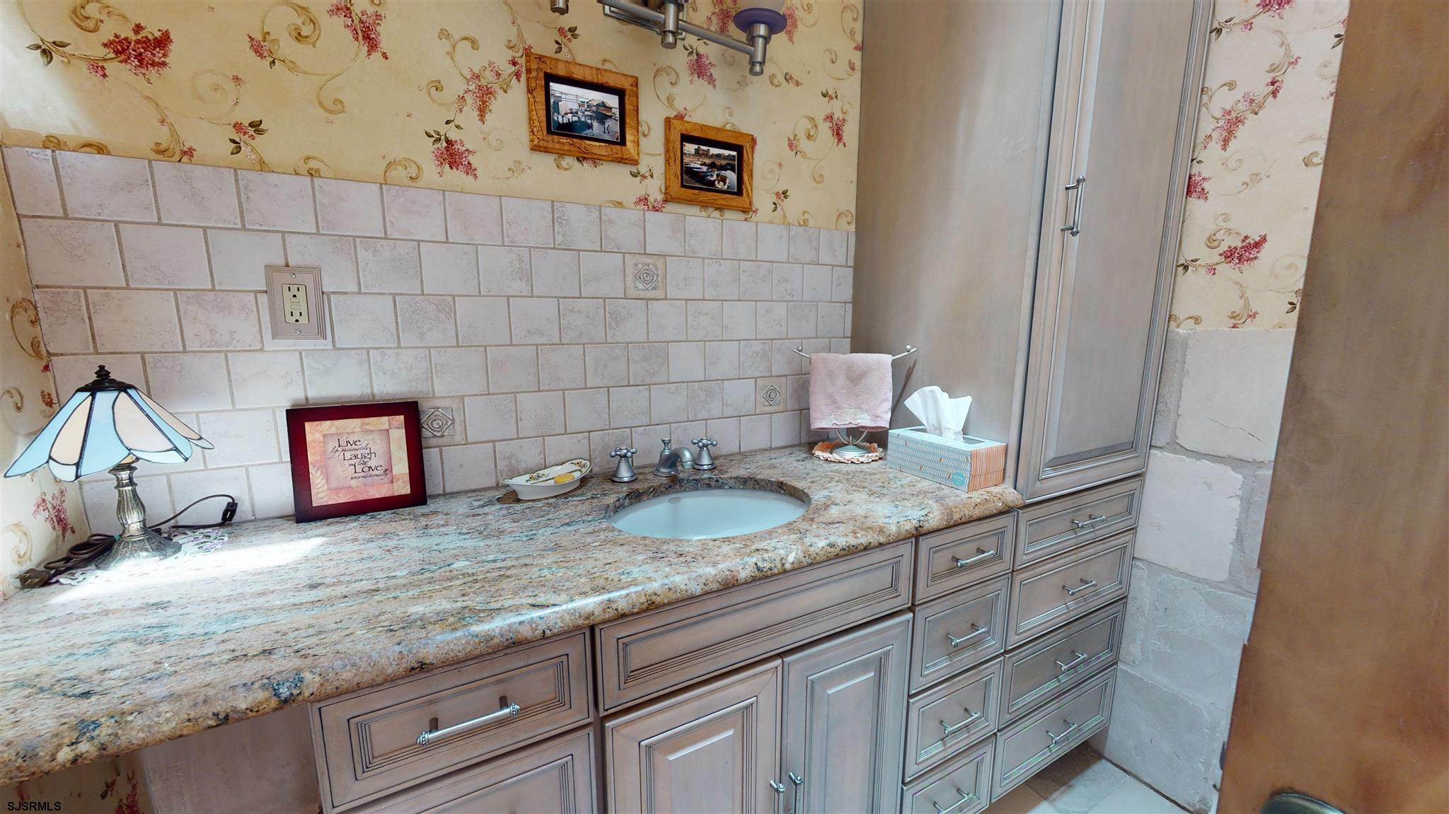 105 Tyler Road Ocean View, NJ 08230 - Photo 31 of 43 a bathroom with a granite countertop sink and a mirror