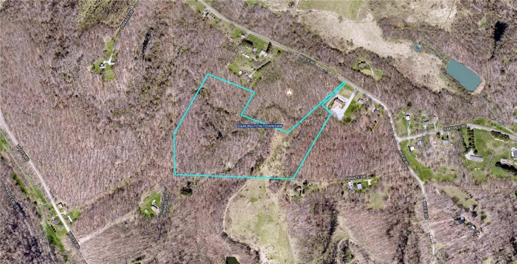 a aerial view of a house with a yard