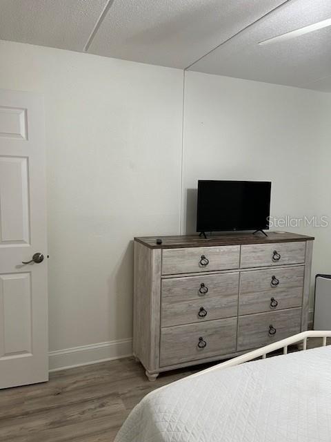 12760 Indian Rocks Road, Unit 803 Largo, FL 33774 - Photo 13 of 18 a view of a dresser with wooden floor