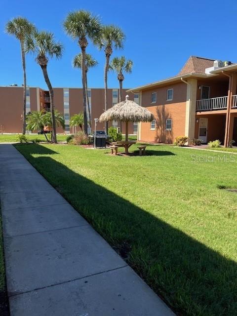 12760 Indian Rocks Road, Unit 803 Largo, FL 33774 - Photo 14 of 18 a front view of house with yard and green space