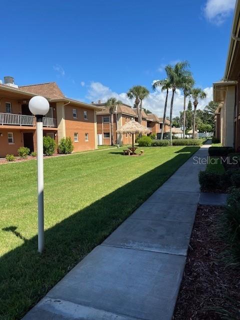 12760 Indian Rocks Road, Unit 803 Largo, FL 33774 - Photo 15 of 18 a view of a house with a yard