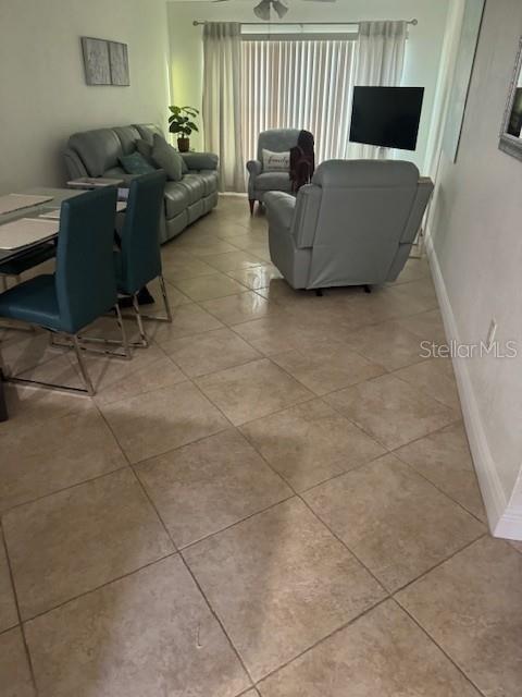 12760 Indian Rocks Road, Unit 803 Largo, FL 33774 - Photo 3 of 18 a living room with furniture and a flat screen tv