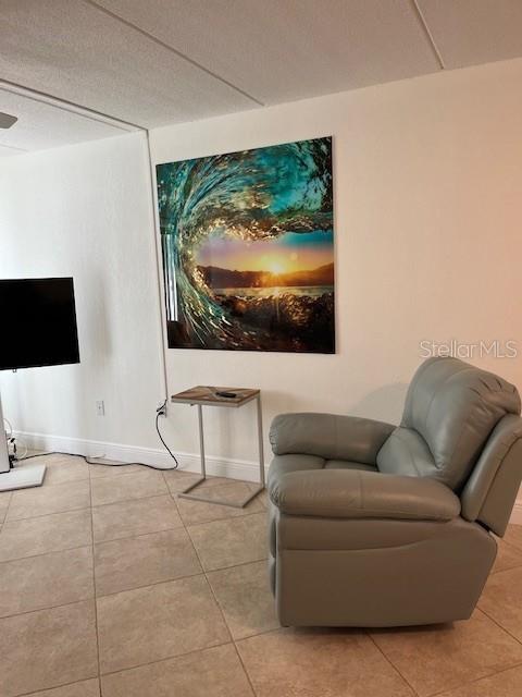 12760 Indian Rocks Road, Unit 803 Largo, FL 33774 - Photo 5 of 18 a living room with furniture and a flat screen tv