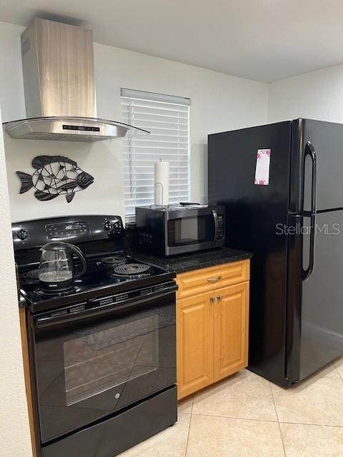 12760 Indian Rocks Road, Unit 803 Largo, FL 33774 - Photo 6 of 18 a kitchen with stainless steel appliances granite countertop a stove and a refrigerator