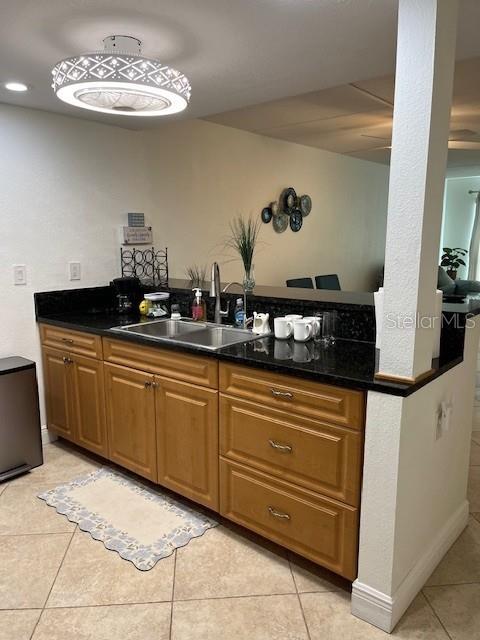 12760 Indian Rocks Road, Unit 803 Largo, FL 33774 - Photo 7 of 18 a kitchen with a sink and cabinets
