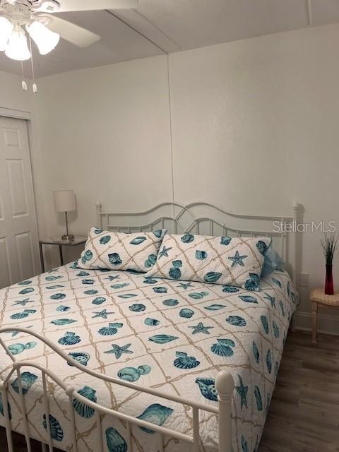 12760 Indian Rocks Road, Unit 803 Largo, FL 33774 - Photo 9 of 18 a bedroom with a bed and a mirror