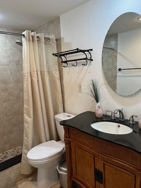 12760 Indian Rocks Road, Unit 803 Largo, FL 33774 - Photo 10 of 18 a bathroom with a sink toilet and shower