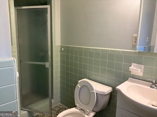 a bathroom with a toilet and a sink