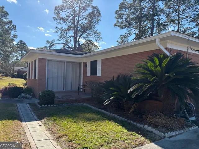 a view of a house with swimming pool in front of it
