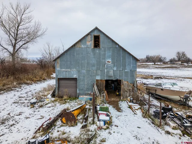 a front view of house with yard seating and yard in back