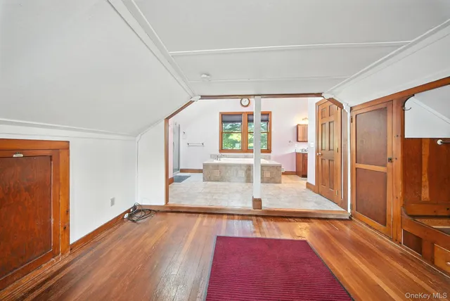 wooden floor with kitchen view