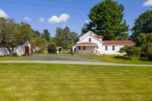 a front view of a house with a swimming pool
