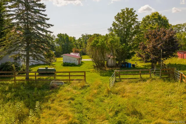 a view of swimming pool with an outdoor space and seating area
