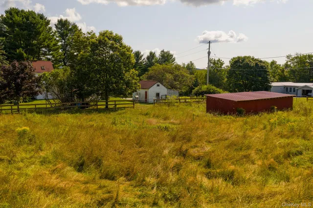 a view of a swimming pool with an outdoor space and seating area