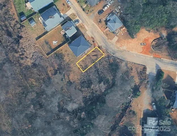 an aerial view of residential house with outdoor space