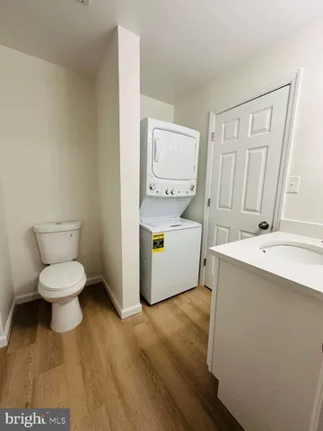 a white toilet sitting next to a bathroom sink