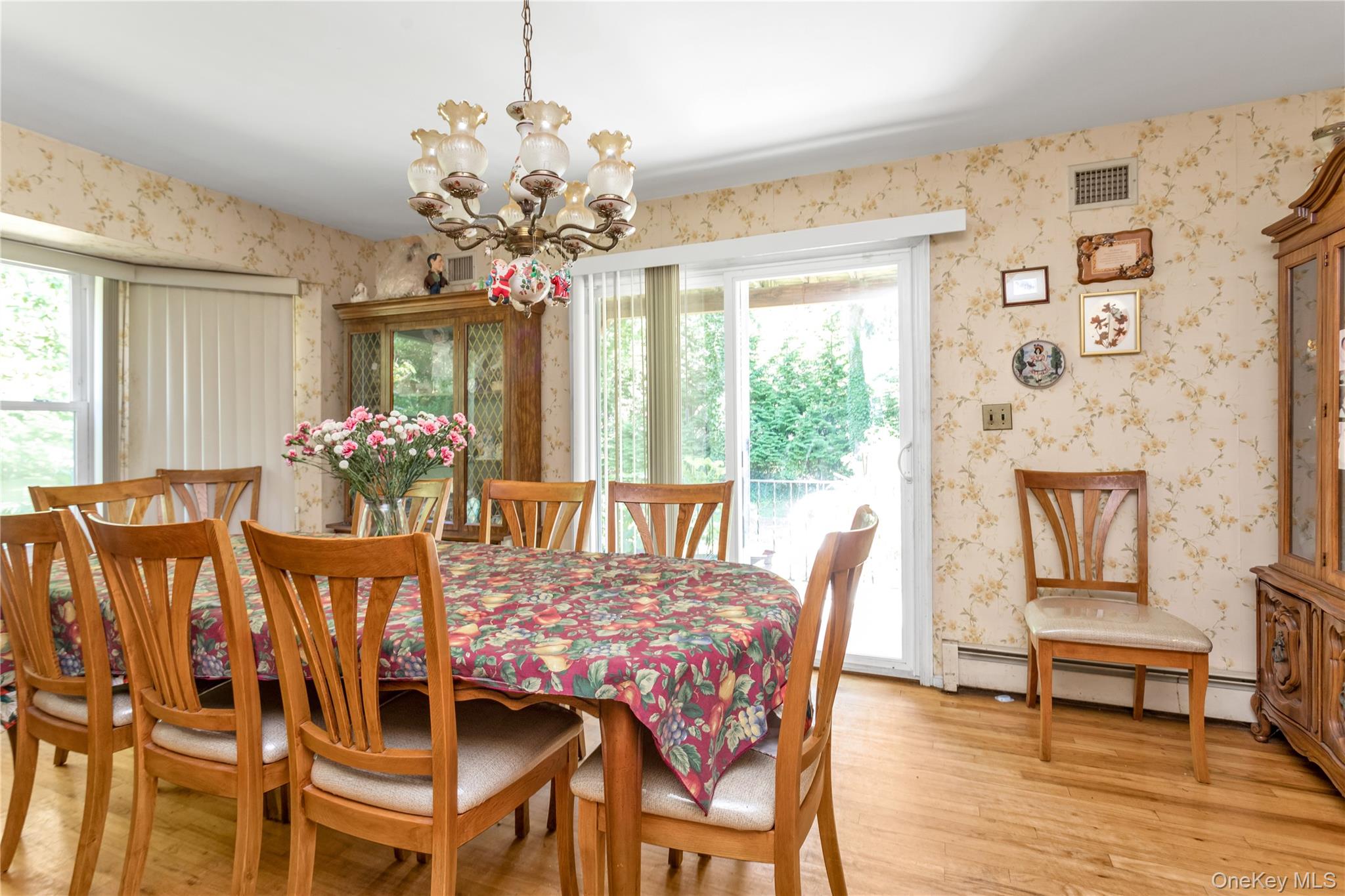 270 Frost Pond Road Glen Head, NY 11545 - Photo 14 of 19 Formal dining room with sliding doors to rear patio