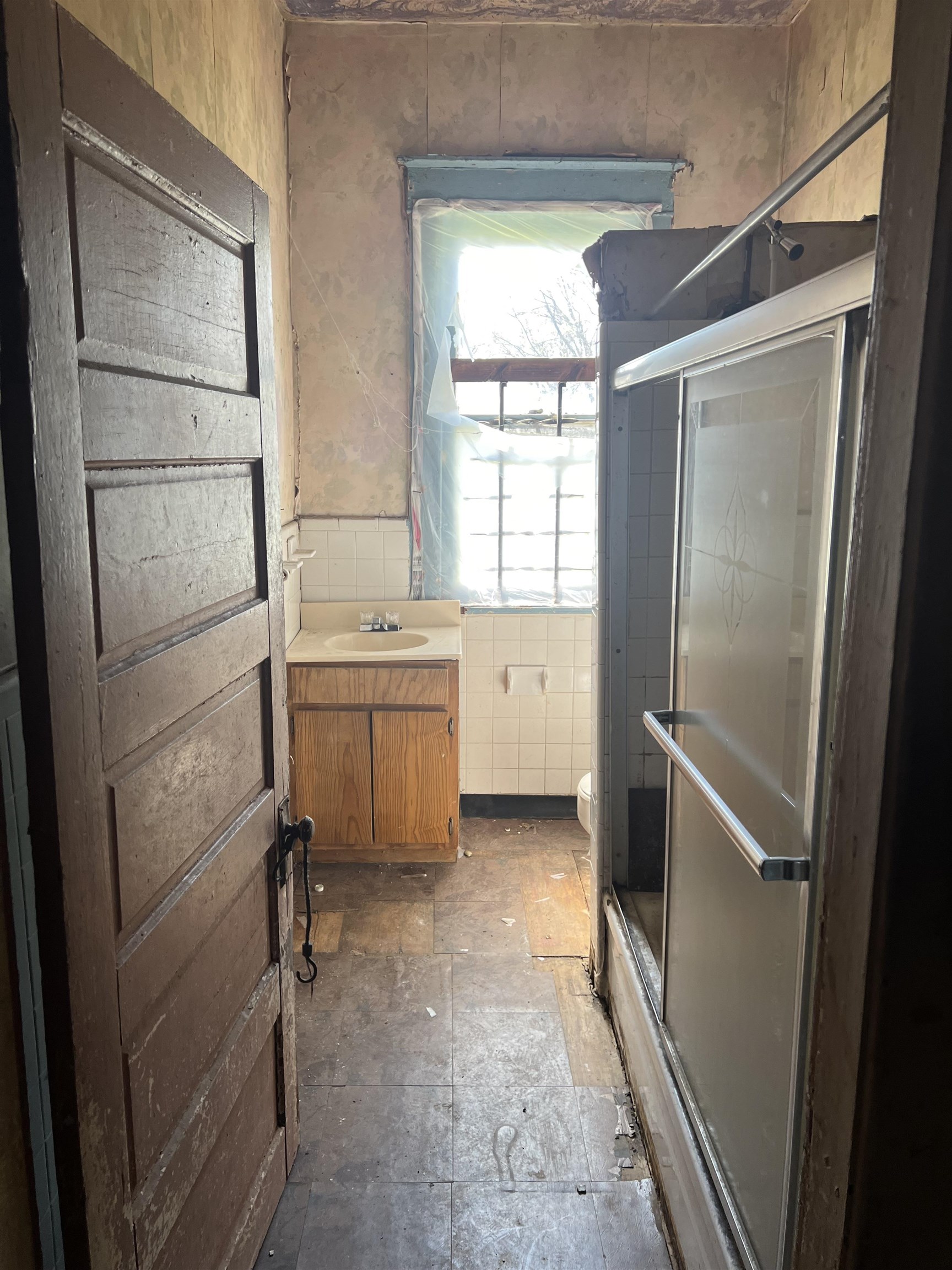 1211 Sylvan Street Memphis, TN 38107 - Photo 16 of 19 a room with a cabinets and a refrigerator