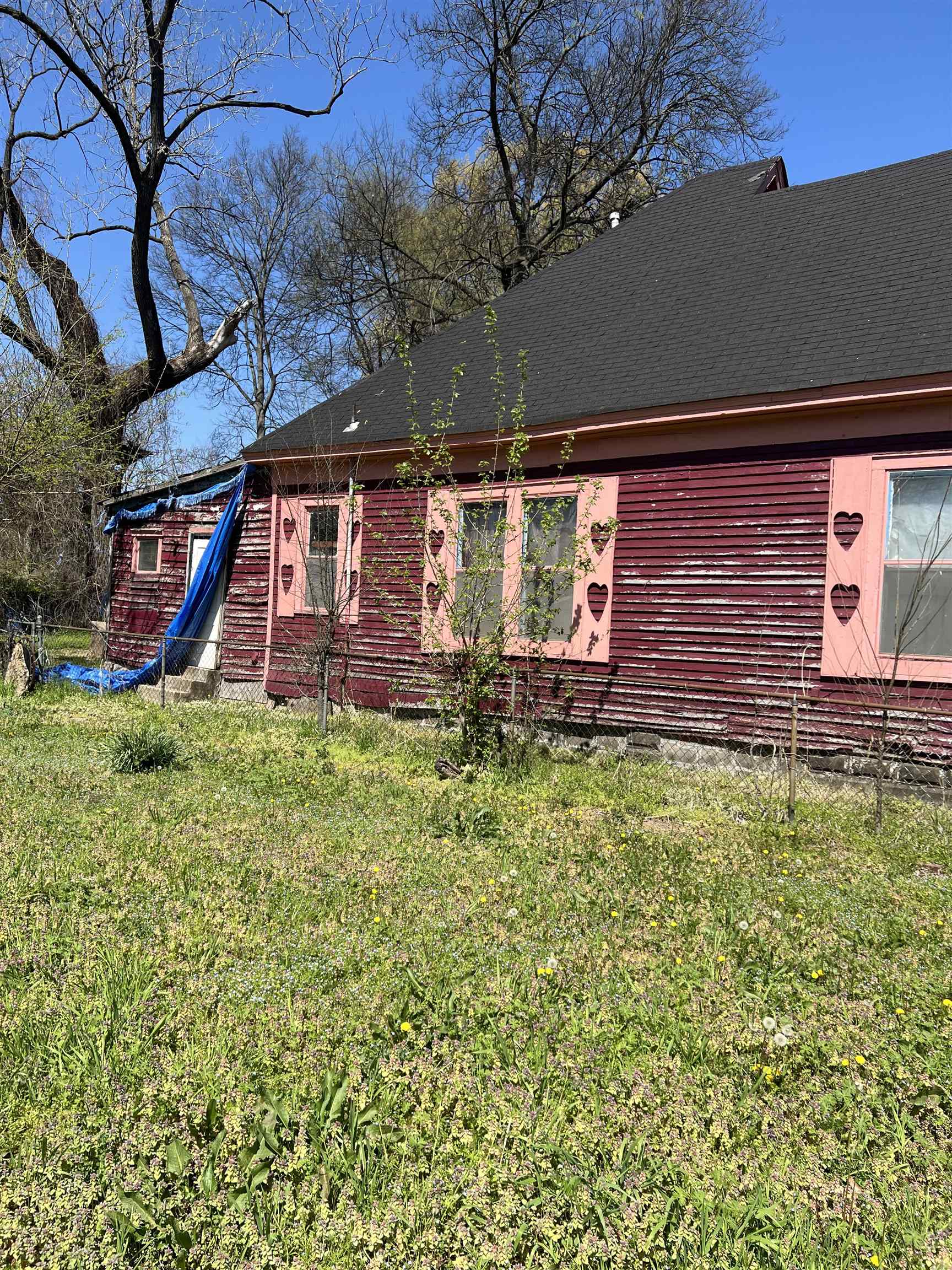 1211 Sylvan Street Memphis, TN 38107 - Photo 5 of 19 front view of a house with a yard