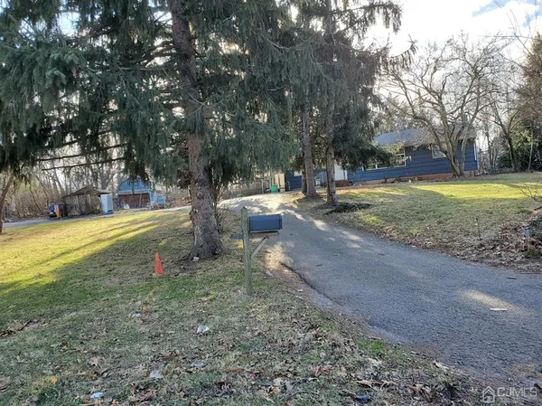 a view of backyard with swimming pool
