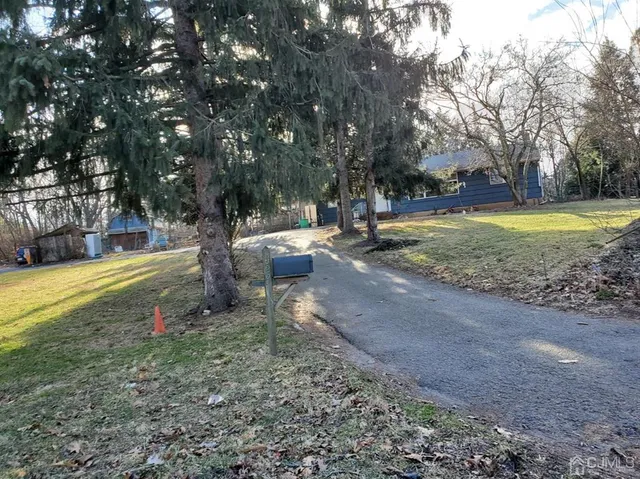 a view of a backyard with swimming pool