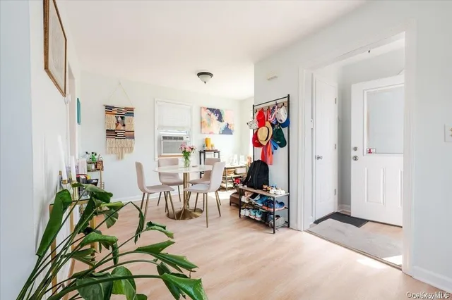 a view of a livingroom with furniture and a potted plant