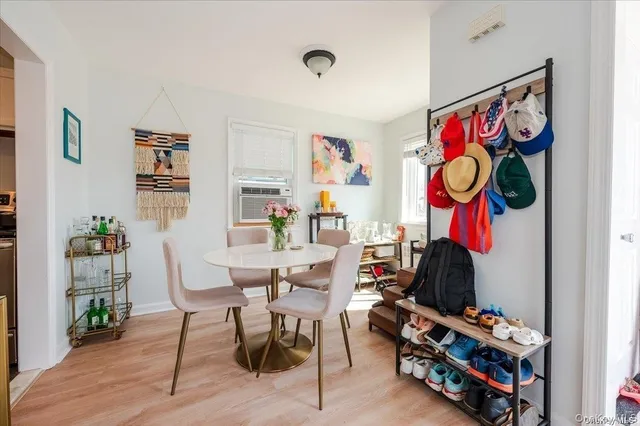 a view of a room with furniture and wooden floor