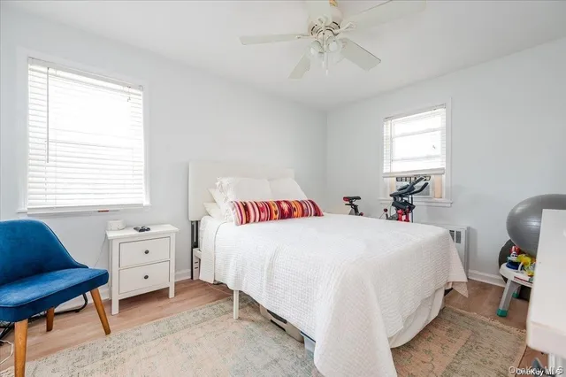 a bedroom with a bed and a lounge chair