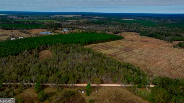 a view of a street with a yard