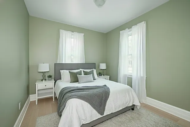 a bedroom with a bed and window