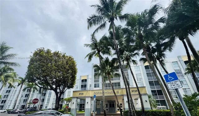 a view of multiple houses with tree s
