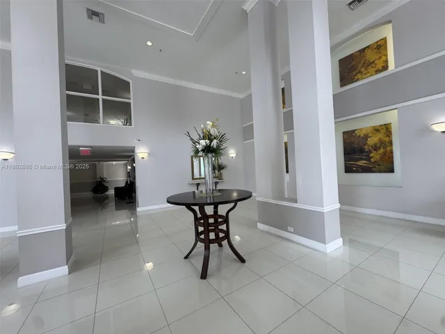 a room with furniture and a chandelier