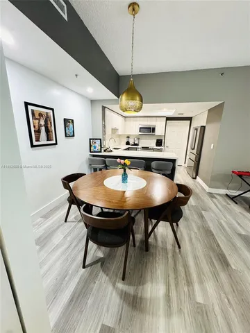 a dining room with furniture and window