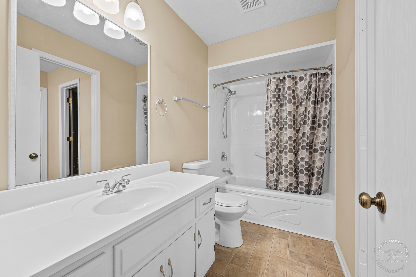 408 Grande Drive, Unit A Minooka, IL 60447 - Photo 15 of 20 a bathroom with a bathtub shower sink vanity and toilet