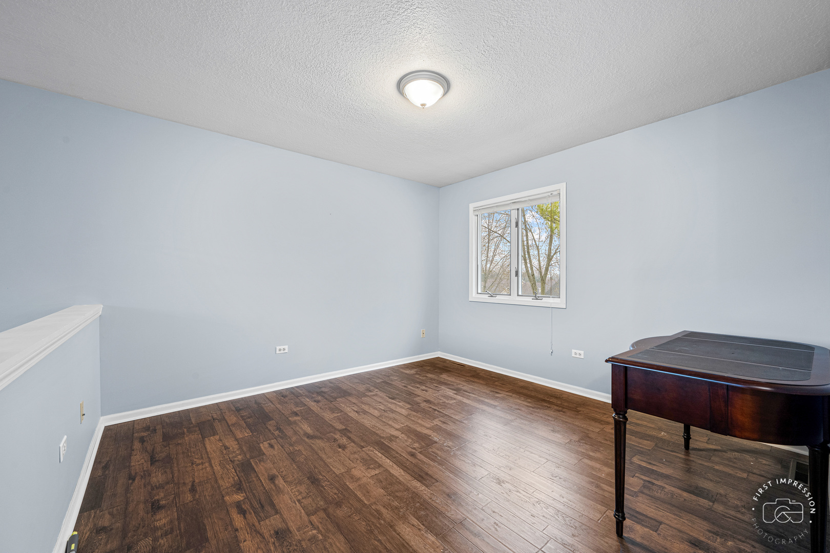 408 Grande Drive, Unit A Minooka, IL 60447 - Photo 16 of 20 a view of room with hardwood floor and cabinet