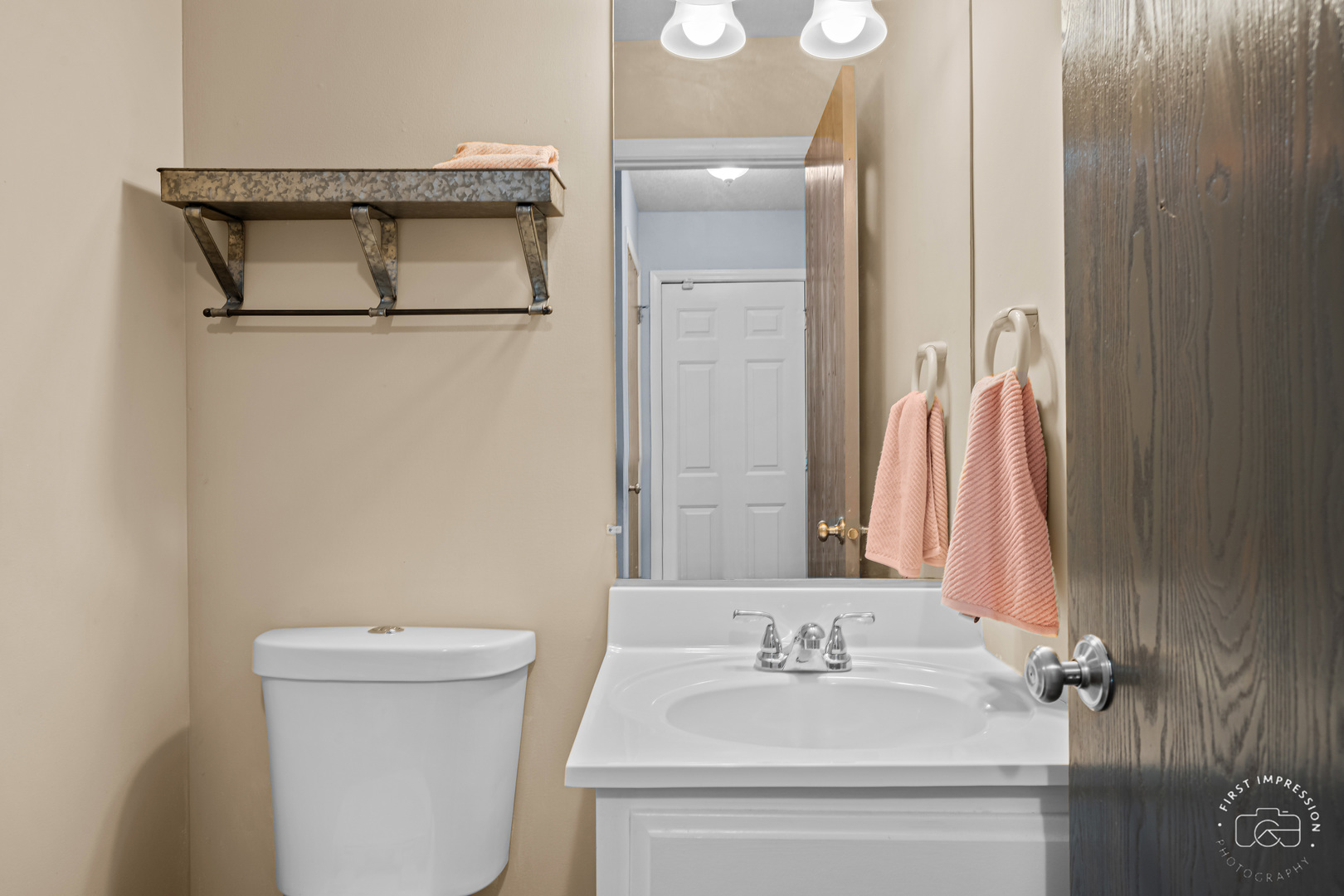 408 Grande Drive, Unit A Minooka, IL 60447 - Photo 10 of 20 a bathroom with a sink toilet and mirror