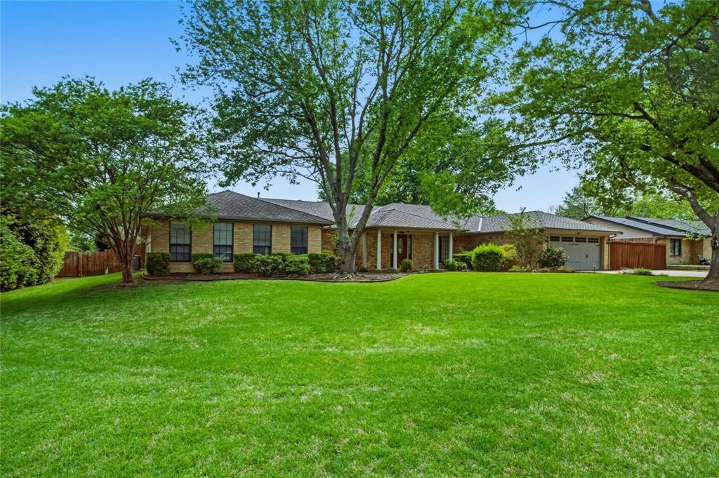 265 East Dove Road Southlake, TX 76092 - Photo 2 of 39 a front view of a house with a garden