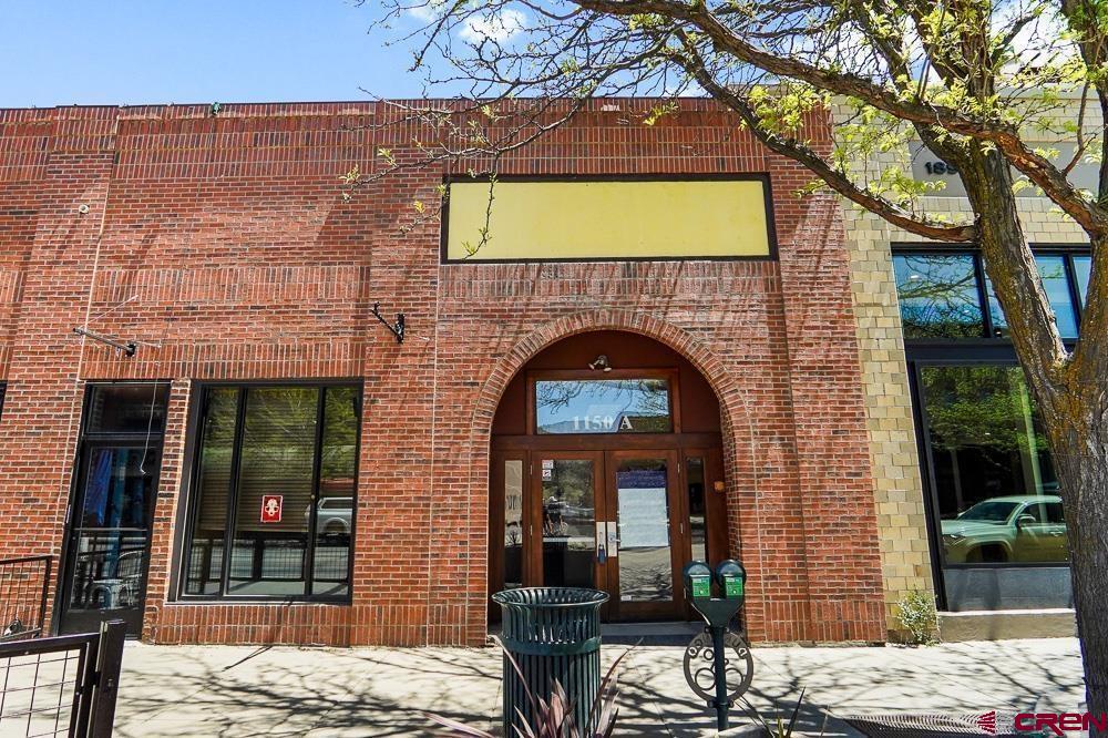 1150 Main Avenue, Unit C Durango, CO 81301 - Photo 1 of 11 a front view of a house with parking