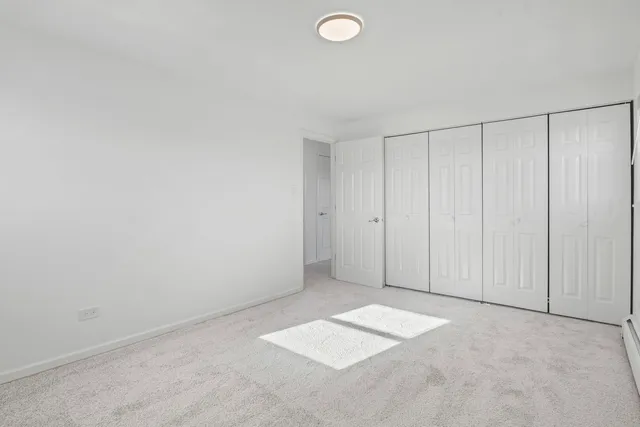 a bathroom with a sink a toilet and shower curtain