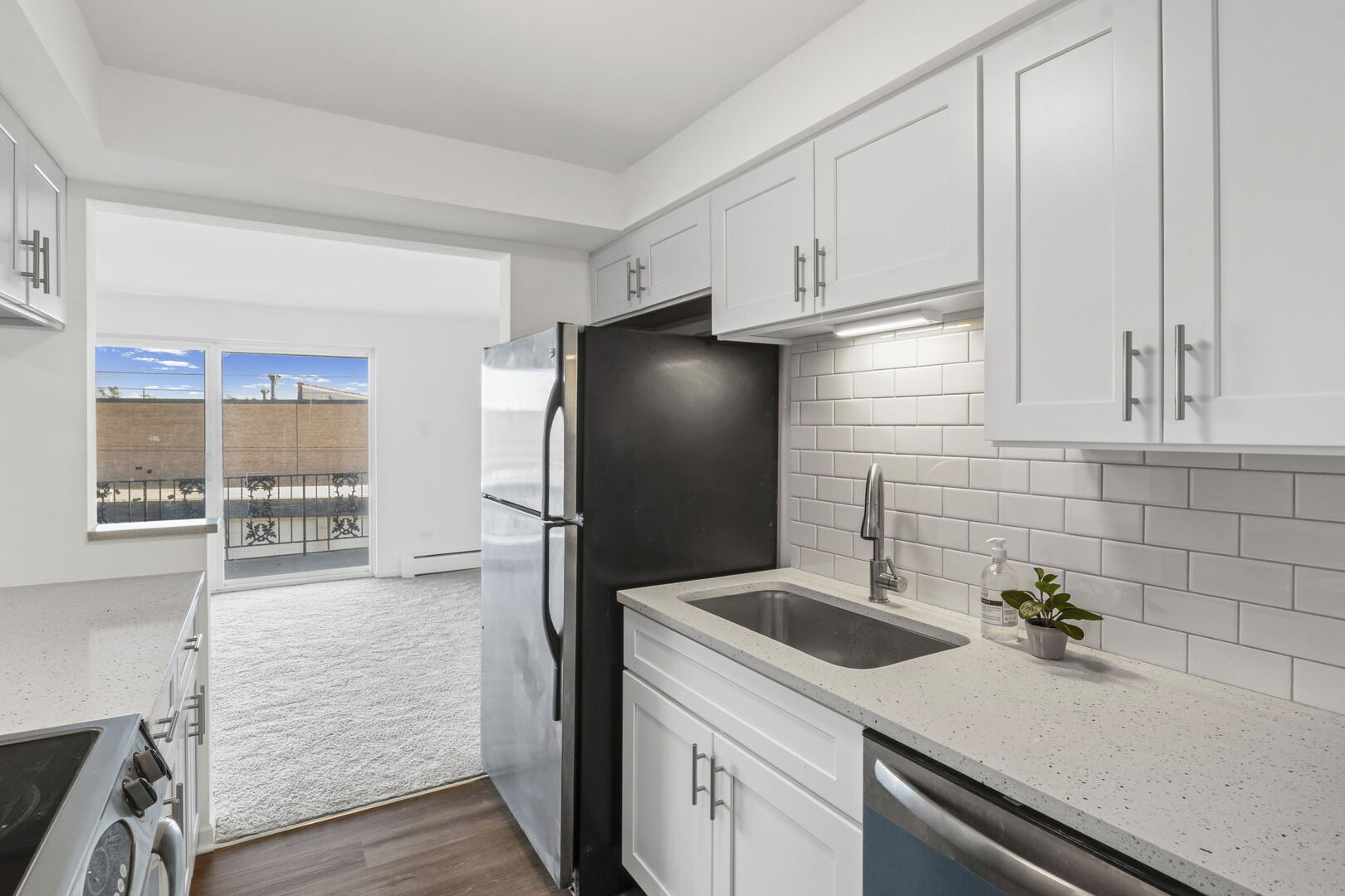 917 South 8th Avenue, Unit 9 La Grange, IL 60525 - Photo 8 of 15 a kitchen with a sink and refrigerator