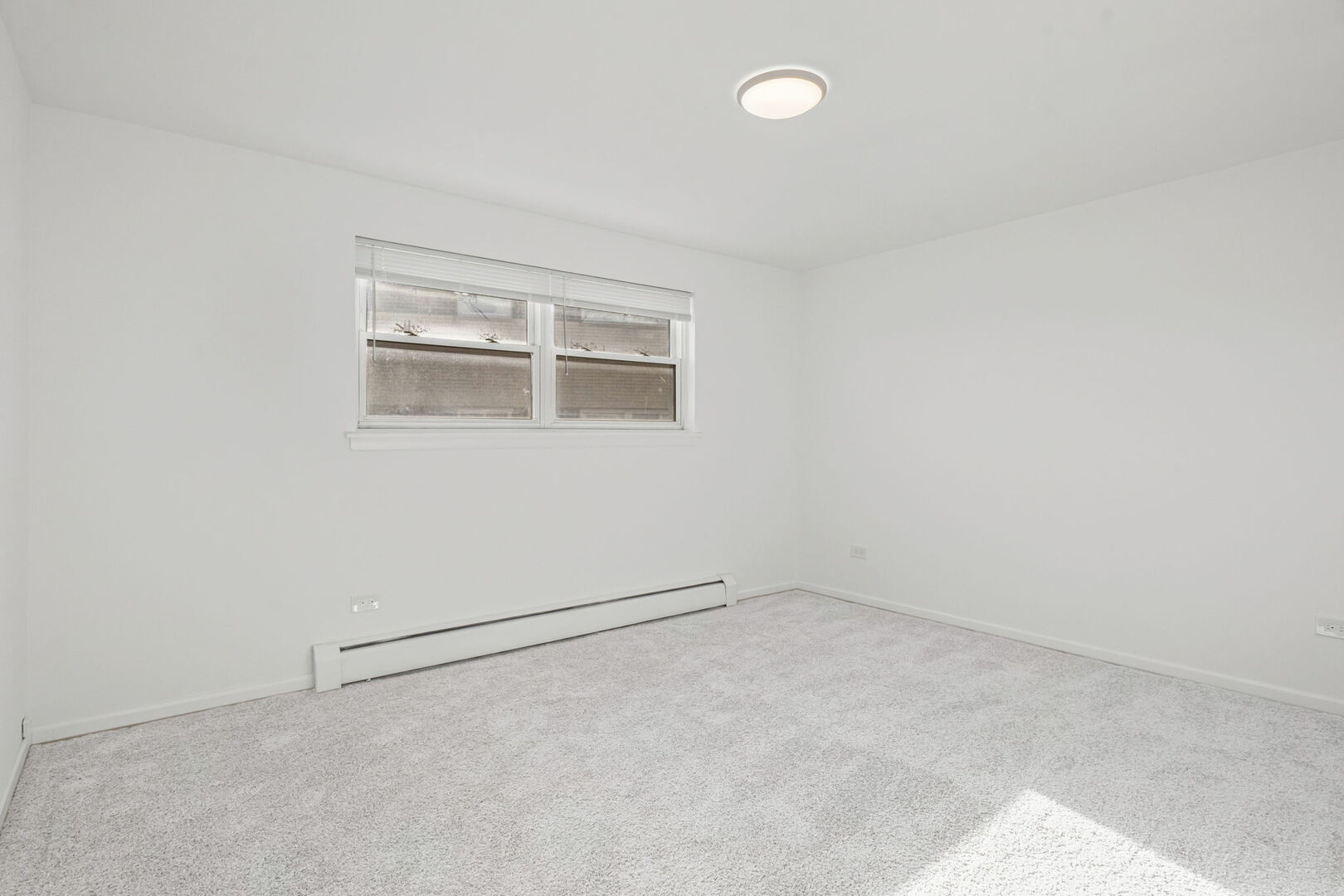 917 South 8th Avenue, Unit 9 La Grange, IL 60525 - Photo 10 of 15 an empty room with a workbench