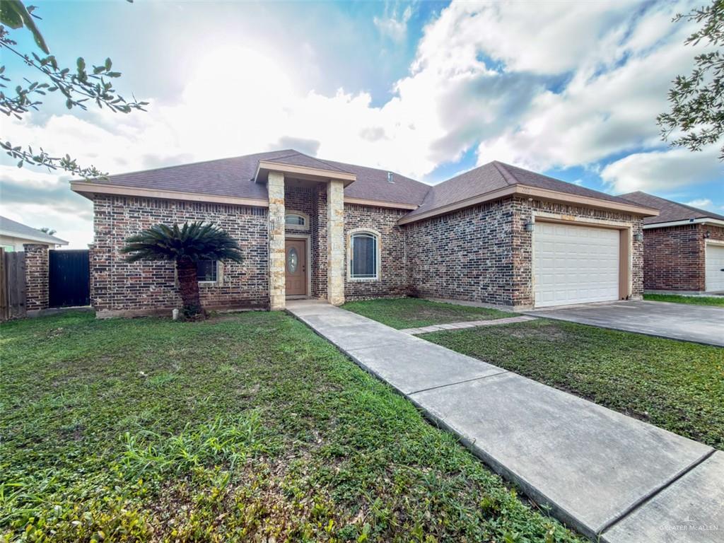 208 North 15th Street Hidalgo, TX 78557 - Photo 8 of 26 front view of a house with a yard