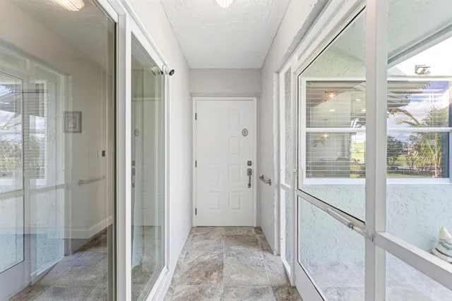 a view of a bathroom with a glass door