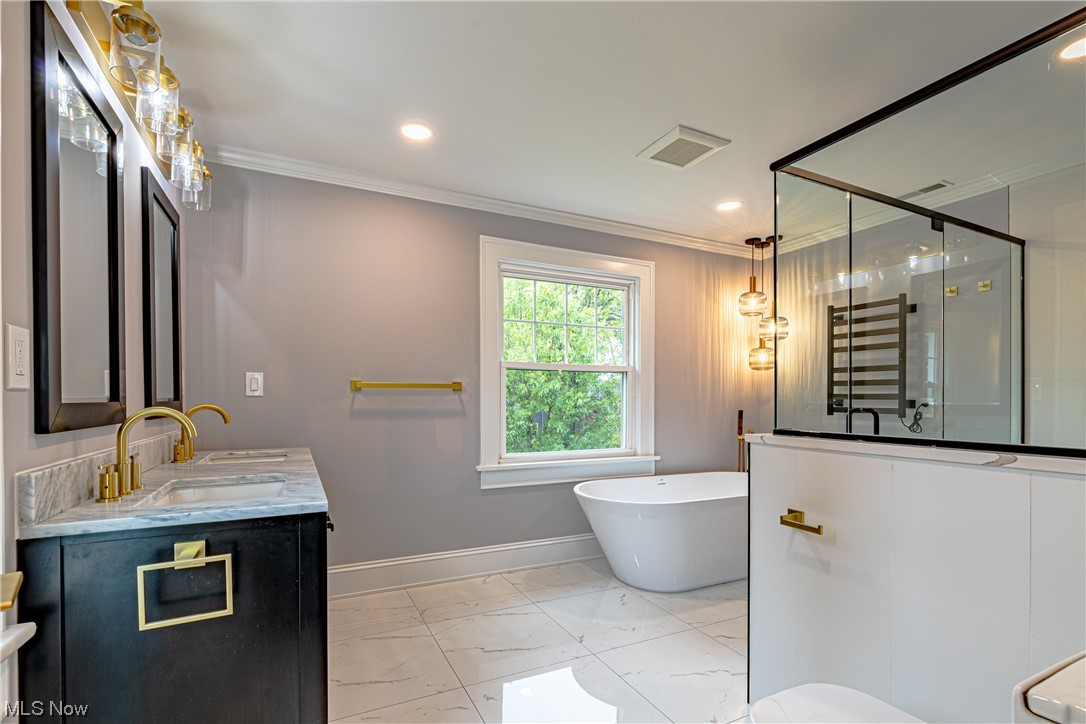 2923 Huntington Road Cleveland, OH 44120 - Photo 26 of 35 Bathroom with tile flooring, independent shower and bath, large vanity, crown molding, and double sink